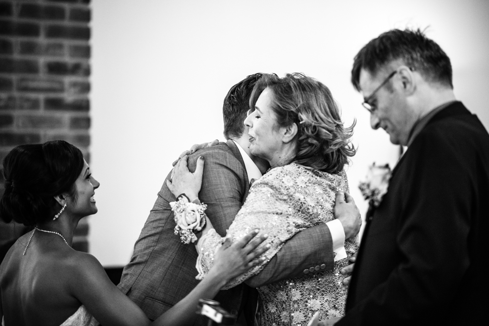 people hugging after ceremony