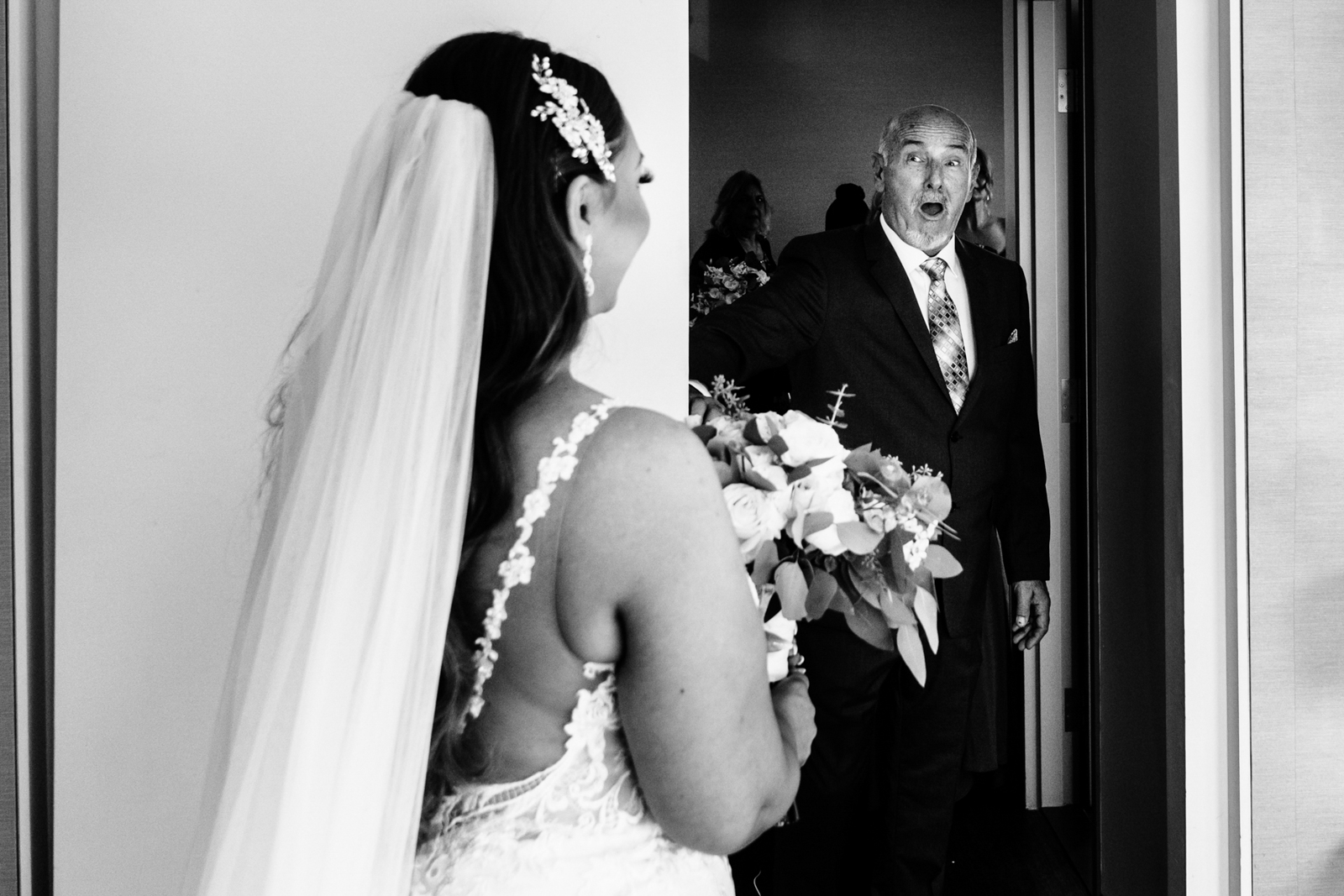 the bride and her father first looking on the wedding day 