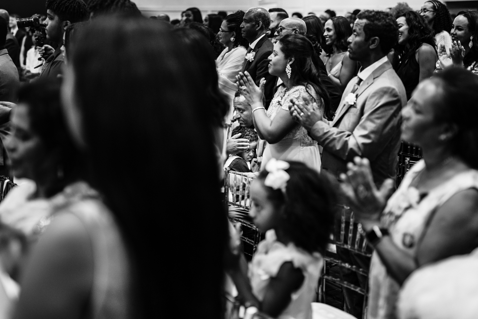 a father is holding his son when the ceremony is hosting