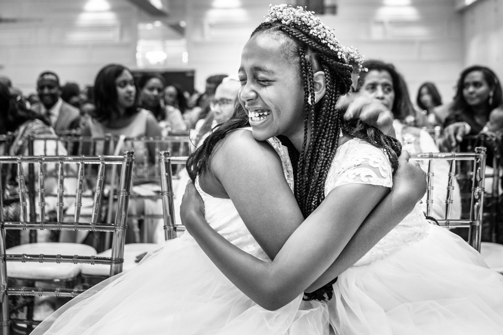 two girls are hugging with tears on wedding ceremony