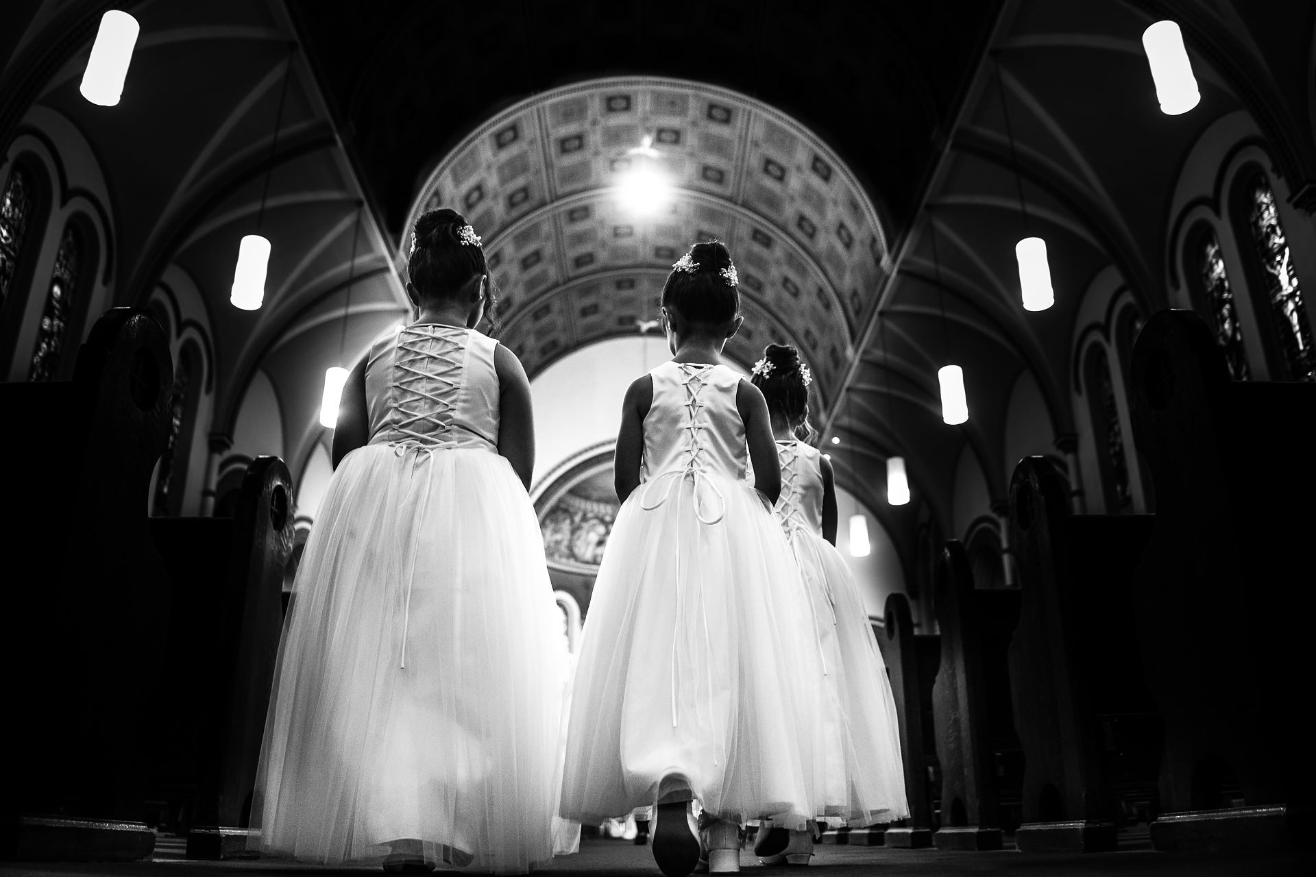 candid moment of flower girls walking down the aisle taken by best documentary wedding photographer cafa liu