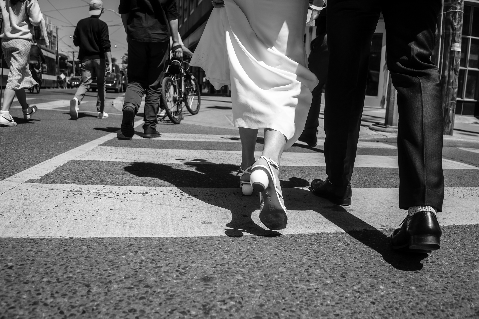 WEDDING COUPLE WALKING ON THE STREET